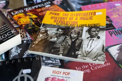 Lots of books related to music, including one in the centre about the Punk Rock revolution.