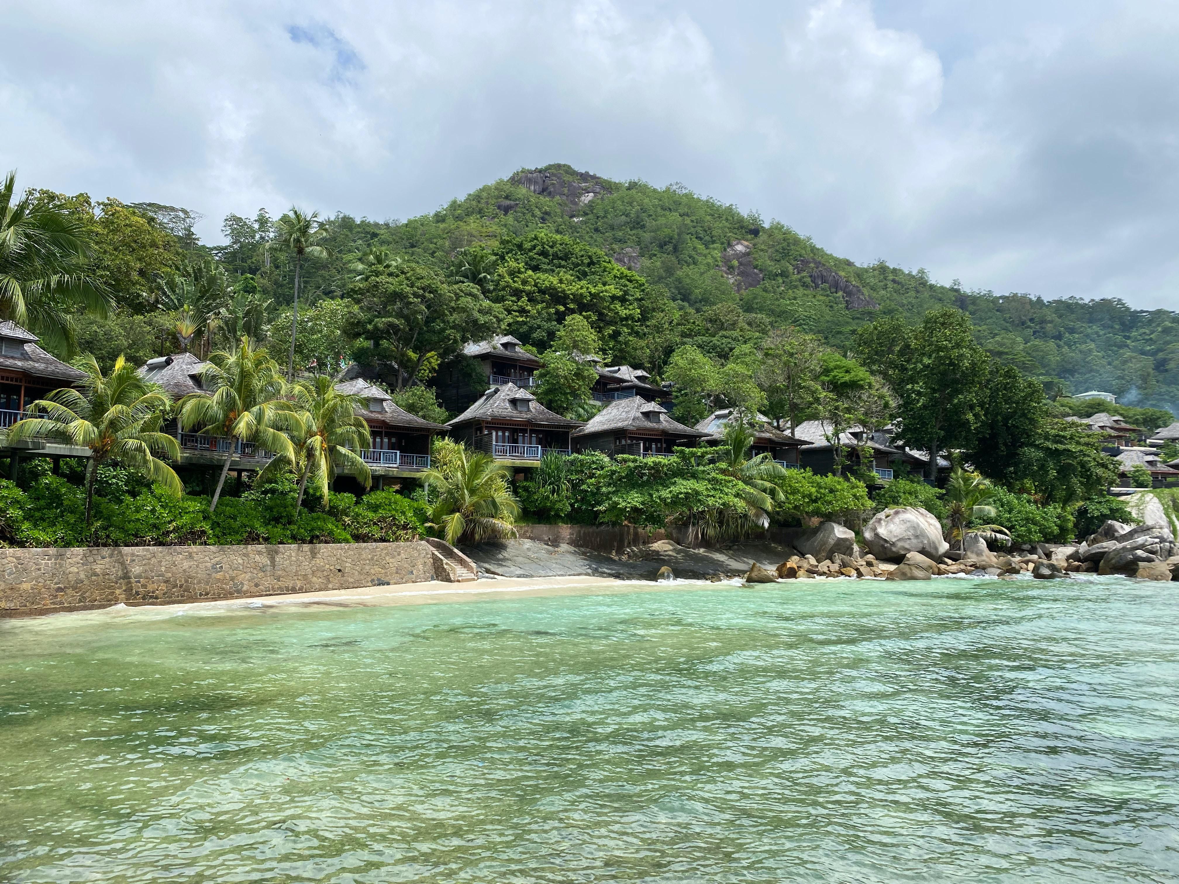 Fancy cabins and inviting beach in Victoria, Glacis, Seychelles.