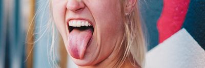 woman showing tongue